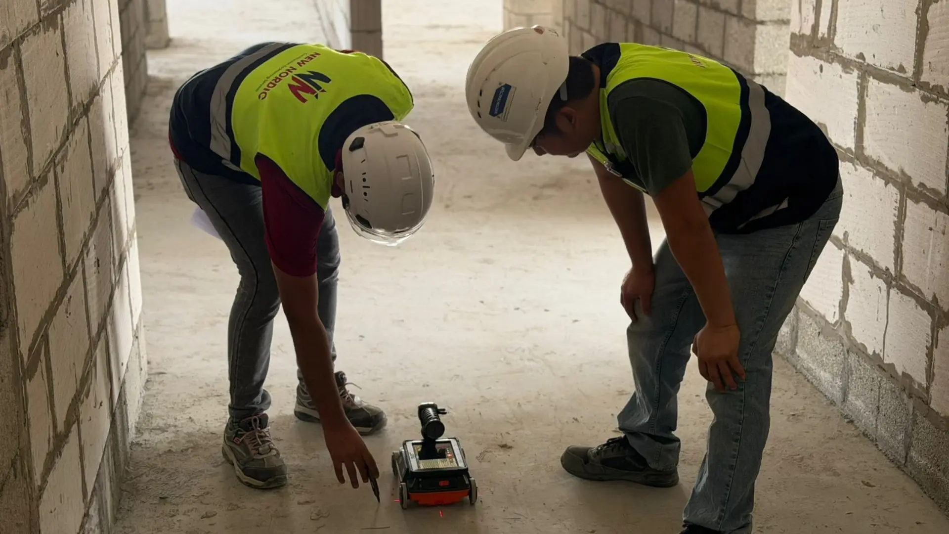 New Nordic engineers scanning a floor slab for moisture ingress inside a building shell