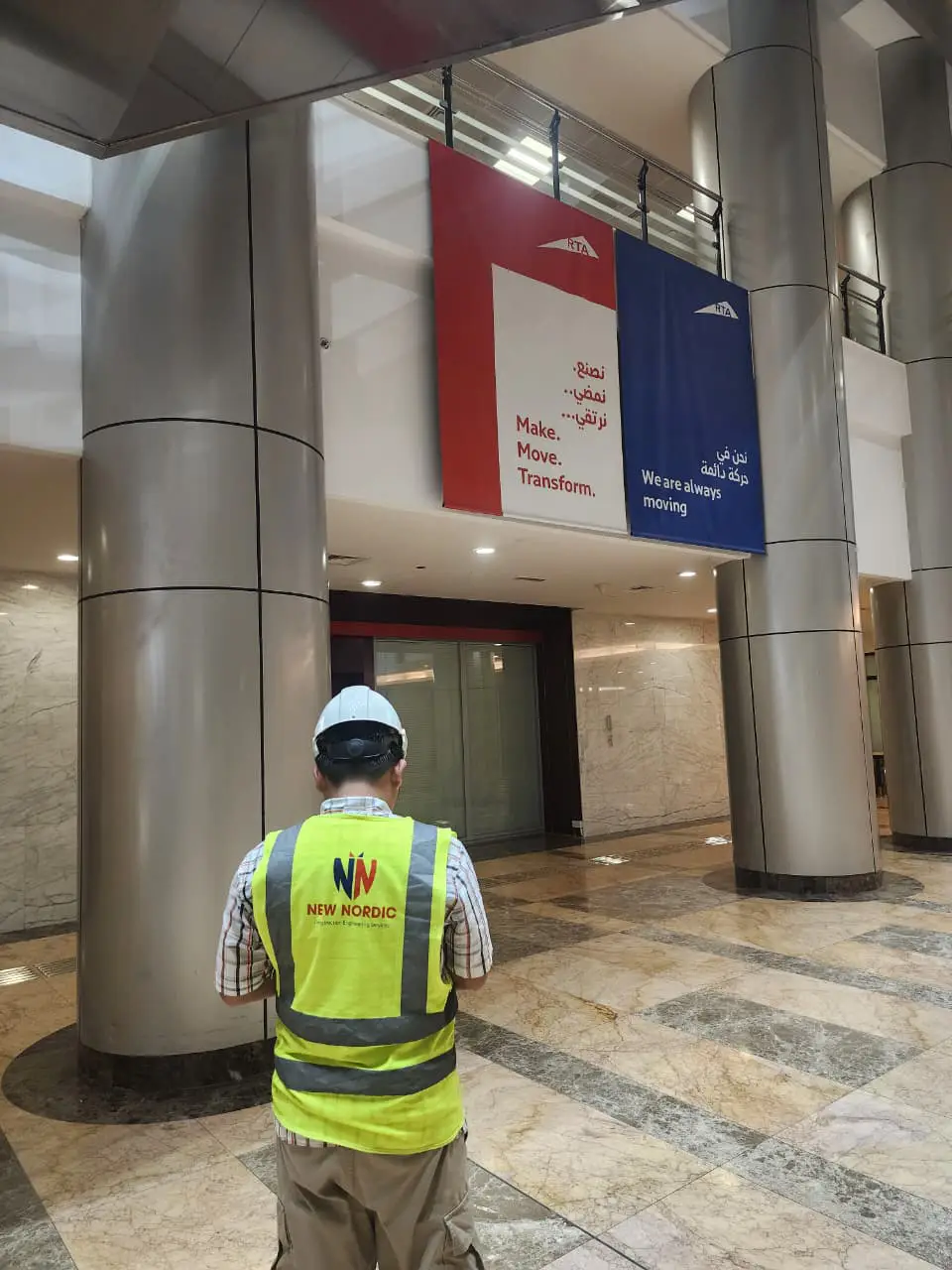 New Nordic engineer surveying a building lobby interior during a water ingress investigation